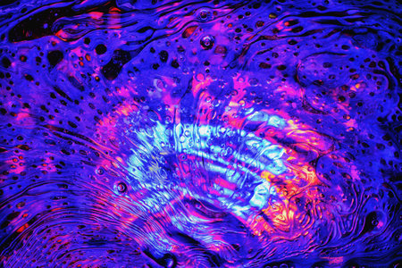 Abstract colorful oil blue background and many bubbles of different sizes on water surface