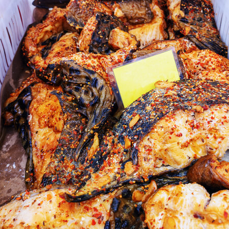 spotted wolffish, hot smoked pieces close up for sale at outdoor marketの写真素材