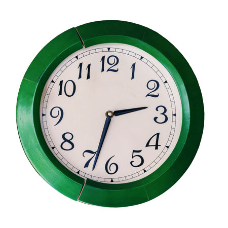 Old round wall clock with green frames isolated on white background