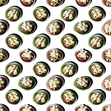 Homemade mini chocolate cupcakes with decorated mini marshmallows as a seamless pattern isolated on...