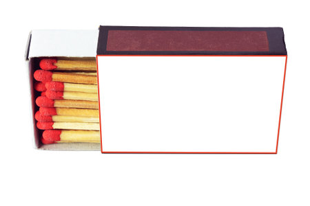 Paper matchbox with red match heads lying on side on white background isolated close up, space for textの写真素材