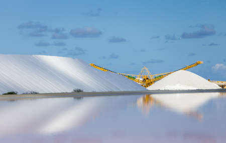 Salt flats in Bonaire (netherlands antilles). Salt pyramids and highly salinated red water.