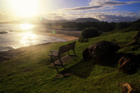 Sunrise over the beach in south west rocks Australia.Relaxing corner in the morning watching the sunrise.Beautiful view point.Beautiful view point watch the sunrise in the morning at South west rocks.の写真素材