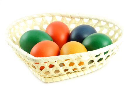 Six colored eggs in basketの写真素材