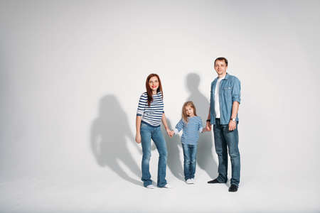 Happy family portrait standing on white background isolatedの写真素材
