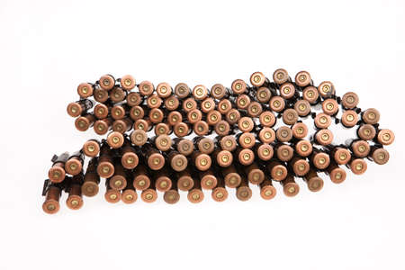 Metal belt with machinegun cartridges on isolated backgroundの写真素材