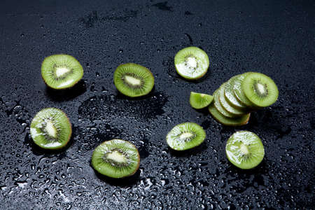 Pieces of kiwi on white backgroundの写真素材