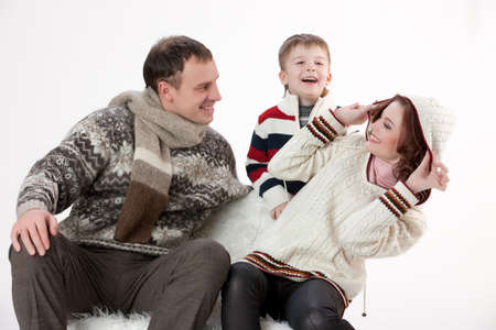 Young woman, man and boy on isolated studio backgroundの写真素材