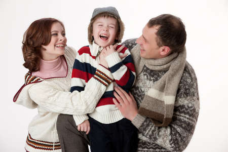 Young woman, man and boy on isolated studio backgroundの写真素材