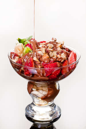 Slices of chocolate in a glass on a glass backgroundの写真素材