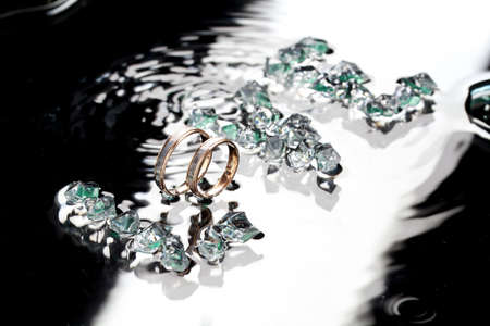 Two golden engagement rings and a word Love set from the crystalsの写真素材