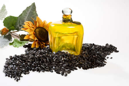 Sunflower and oil on an isolated studio backgroundの写真素材