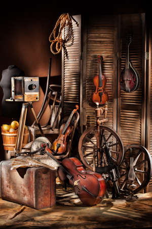 Old photocamera, violins on a studio backgroundの写真素材