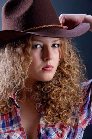 Young attractive woman on isolated background in the studioの写真素材