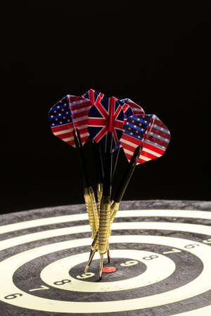 Indoor game Darts on a black studio backgroundの写真素材