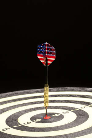 Indoor game Darts on a black studio backgroundの写真素材