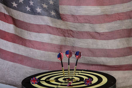 Indoor game Darts and american flag on a studio background
