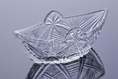 Crystal vase on a glass studio backgroundの写真素材