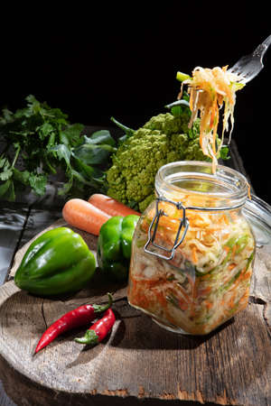 Cabbage and vegetables on an old wooden backgroundの写真素材