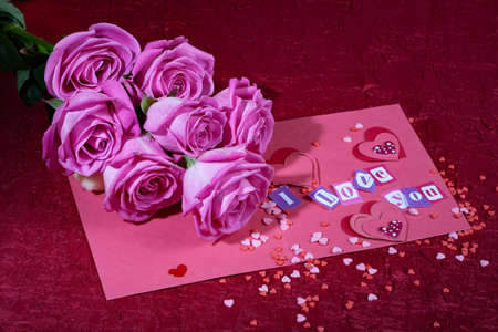 Roses and letters on a studio background