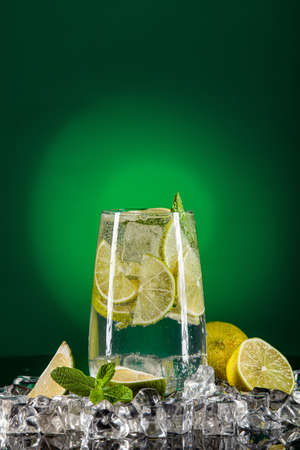 Glass of water, crystals of ice and limeの写真素材