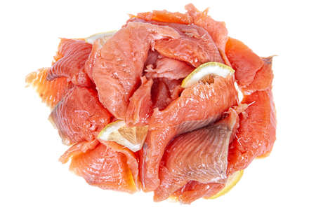Pieces of red fish on an isolated studio background