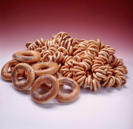 Still life with different kinds of bread and pastry on a studio background