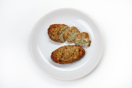 Plate with meat cutlets on an isolated studio backgroundの写真素材