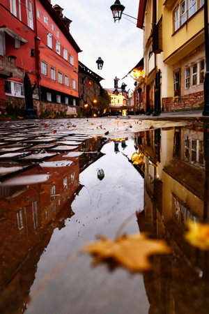 Old street in a small town after rain AI generatedの素材