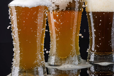 Glass of beer with foam, bubbles and dropsの素材