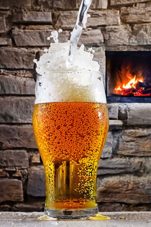 Glass of beer with foam, bubbles and dropsの素材