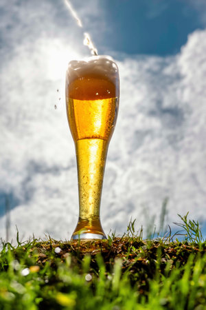 Glass of beer with foam, bubbles and dropsの素材