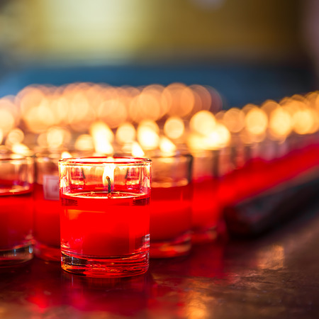 Red candle is kindle a fire in glassの写真素材