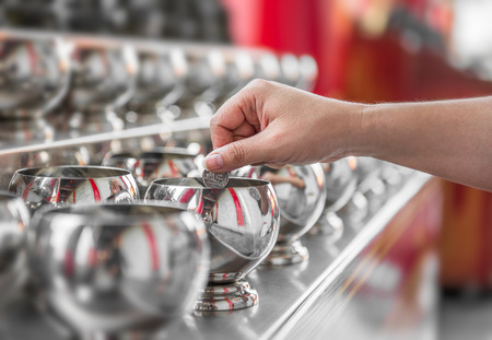 Buddhist is donate the thai bath money for buddhismの写真素材