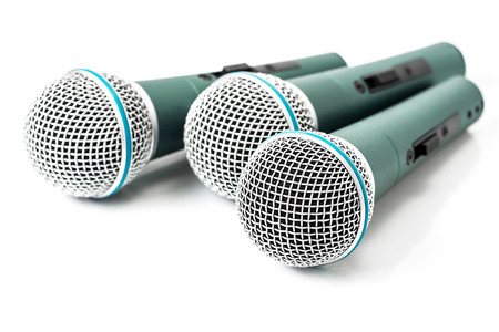 Triple green microphone isolated on white backgroundの写真素材