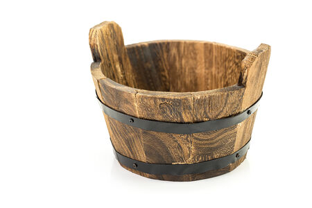 Traditional wooden bucket isolated on white backgroundの写真素材