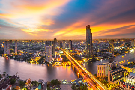 Skyscraper on night scene cityscape at Chaopraya river in Bangkok metropolis Thailand