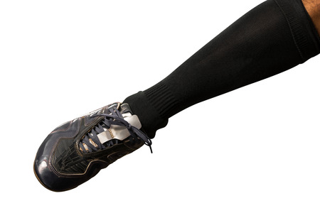 Soccer player foot isolated on white background with clipping path