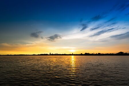 Soft and motion blur cloud on blue sky at riverside in sunset time