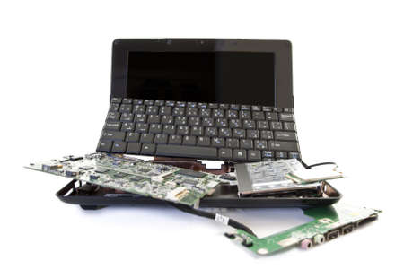 broken laptop disassembled into parts