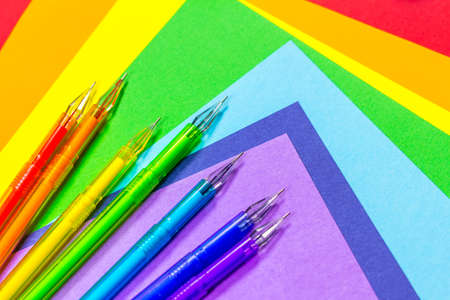 Back to school. School supplies are laid out in the form of a rainbow. Pens, rainbow colors lie on...