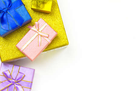 Purple, pink, blue and gold gift box with white background. Holiday greeting card. Christmas, new year, birthday. Space for textの写真素材