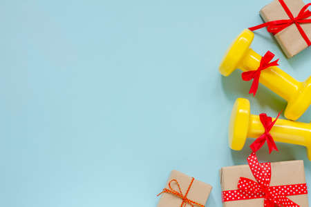 Exercise, fitness and developing the concept of a merry Christmas and a happy New year. Dumbbells...