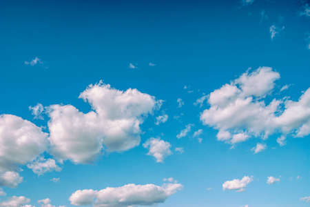 Blue sky with lots of thick clouds. Sky background. Cloudy weather.の写真素材