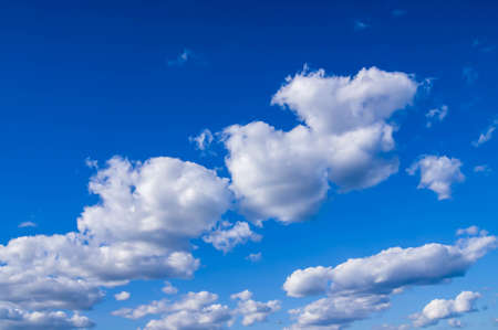 Blue sky with lots of thick clouds. Sky background. Cloudy weather.の写真素材