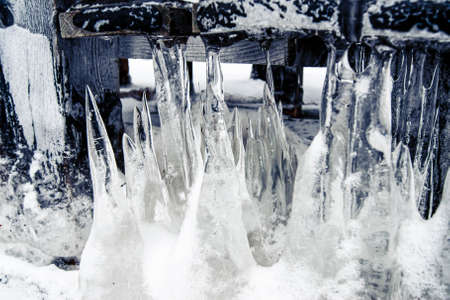 Icicles come out of the ground. Cold winter and snowy winter. Wildlife. The stylized treatment of the mood.の写真素材