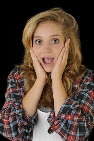 A young, attractive and happy woman is screaming の写真素材