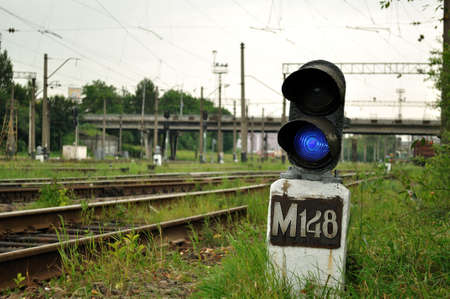 Blue signal lamp beside the railwayの写真素材