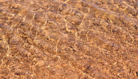 Beautiful mountain river bottom background and textureの写真素材