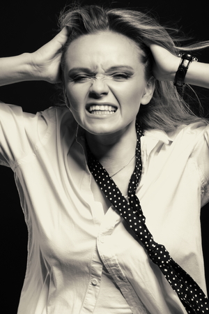 black white portrait, the girl is experiencing stressの写真素材